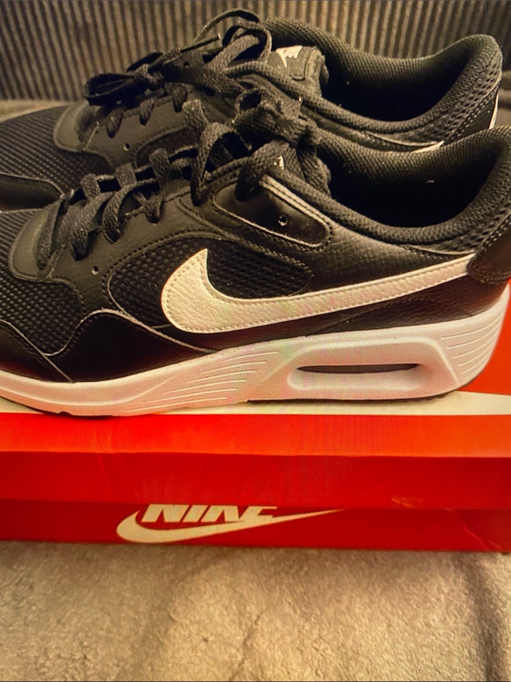 Nike Men’s Black Sneakers with White Swoosh